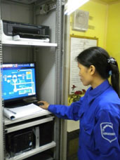 A Vinacomin technician operates a methane monitoring system at the Khe Cham mine.